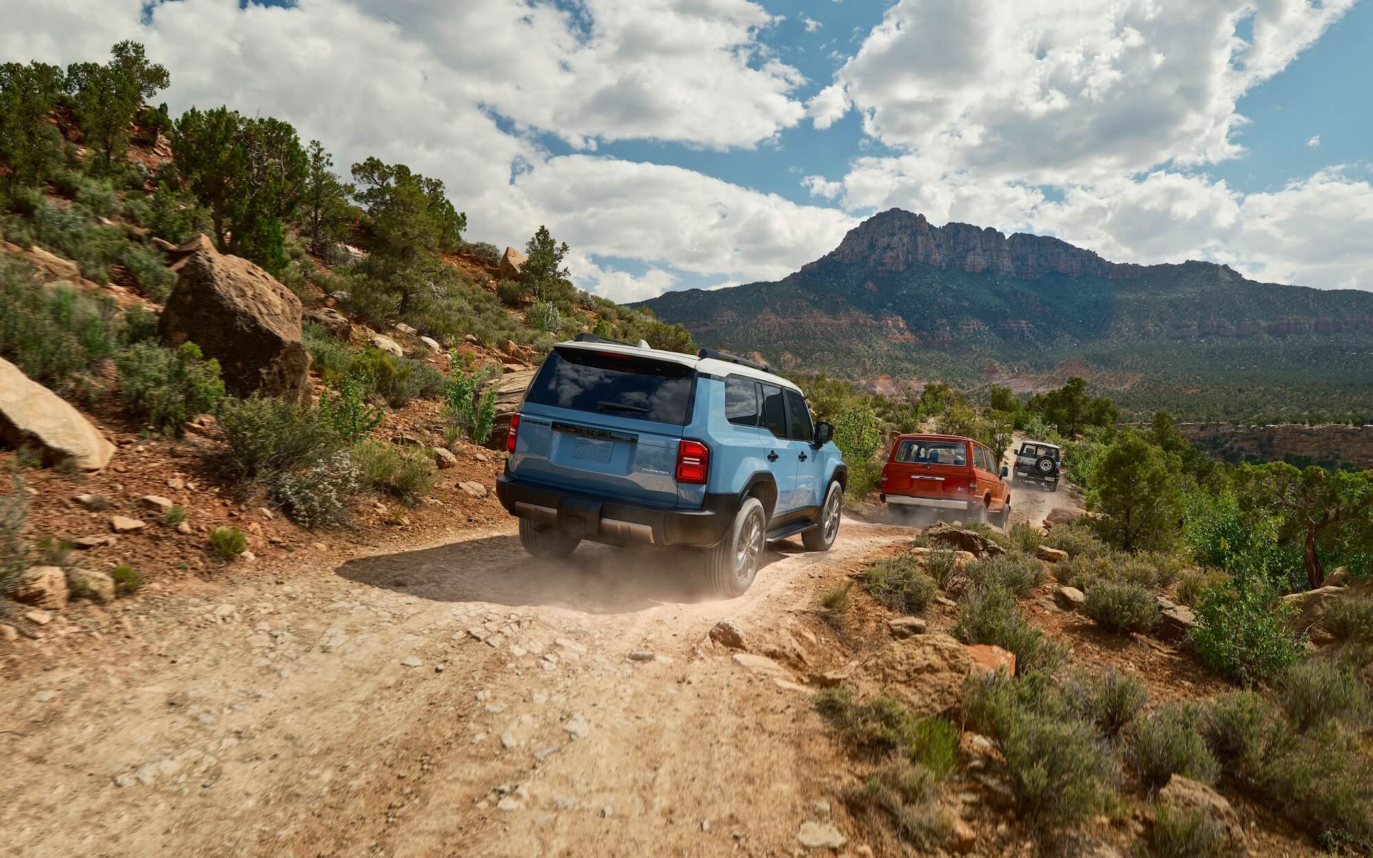 Toyota vehicles driving offroad